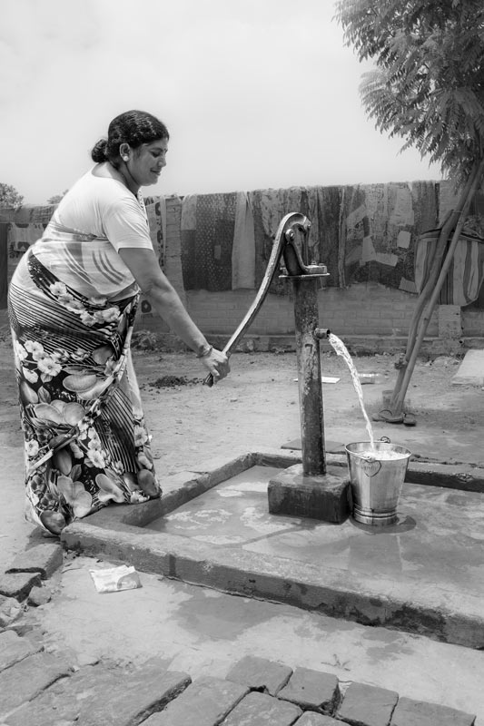Handpump yielding drinking water throughout the year - a result of watershed management under Jaya Devi's leadership